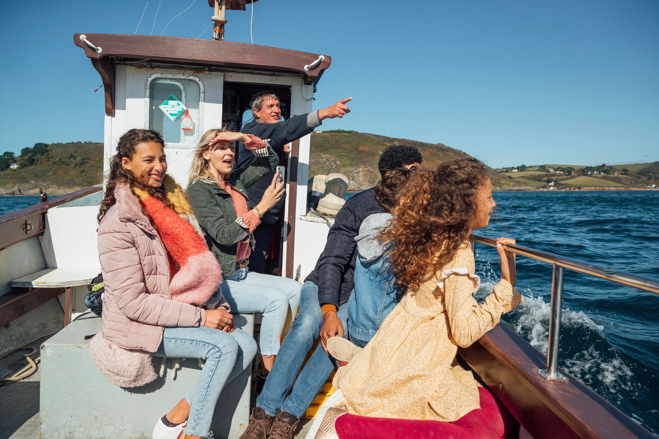 Family enjoying a coastal boat excursion