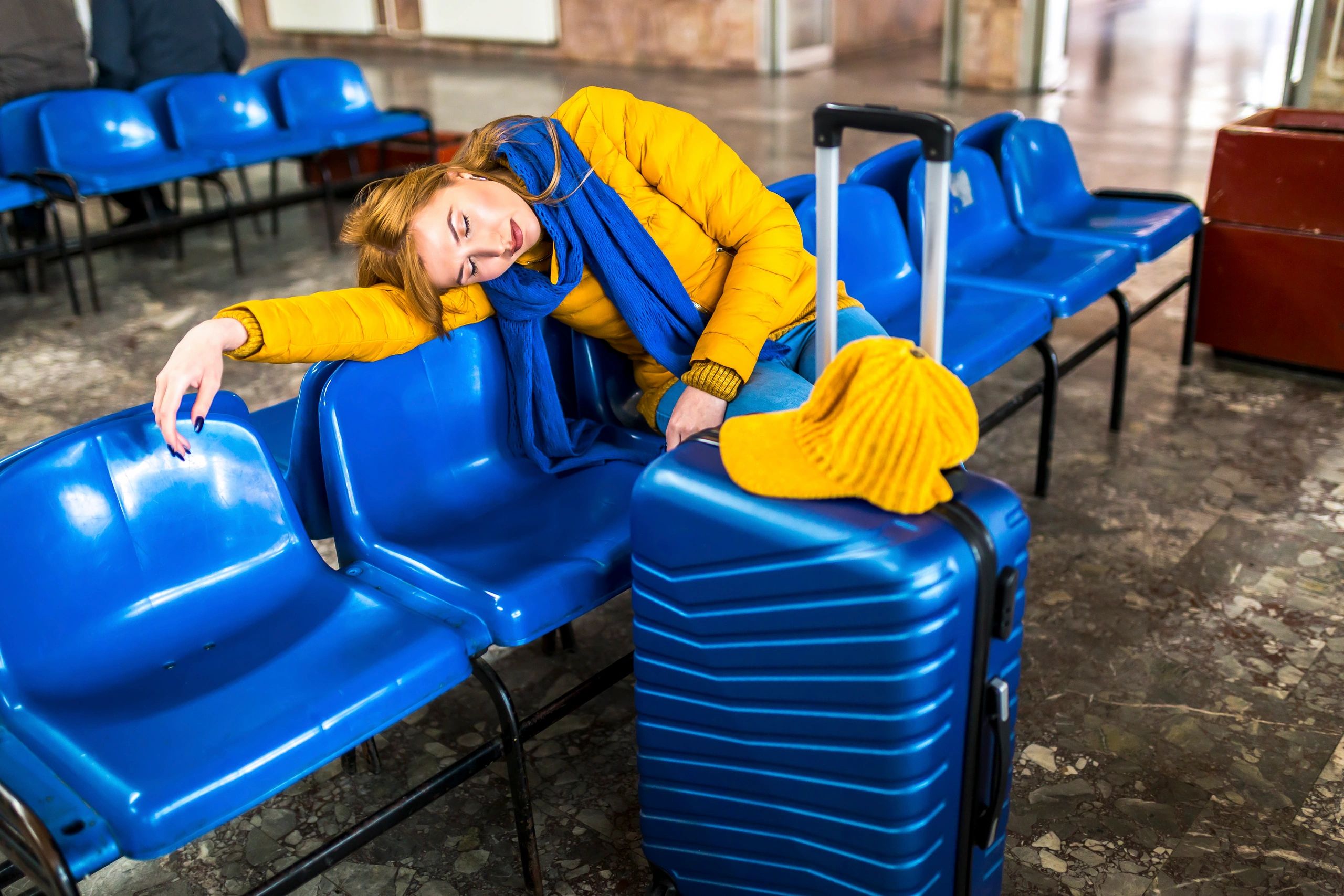 Traveller resting at a station during a journey