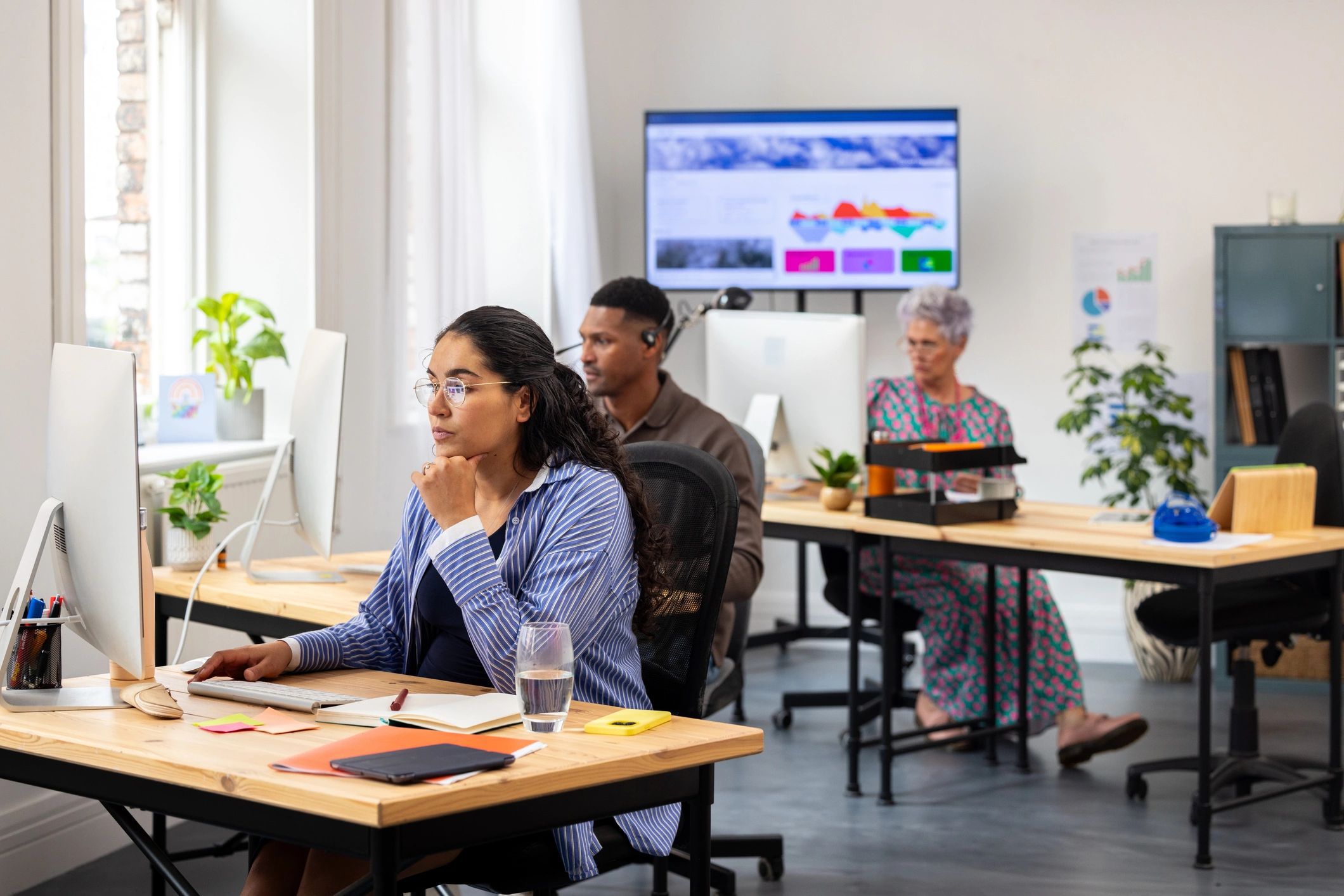 Professional travel planning team working in a modern office