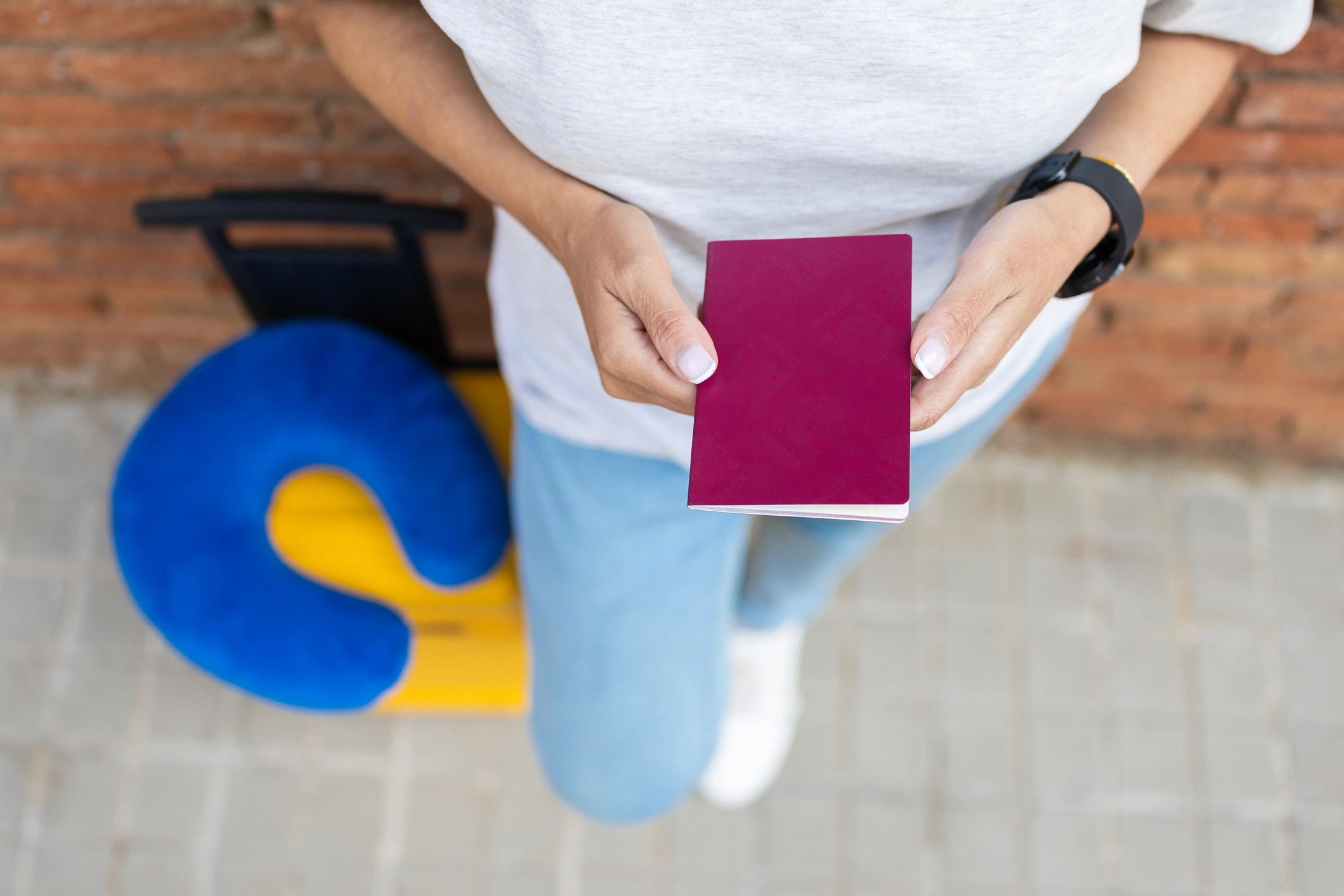 Traveller holding passport ready for an international journey