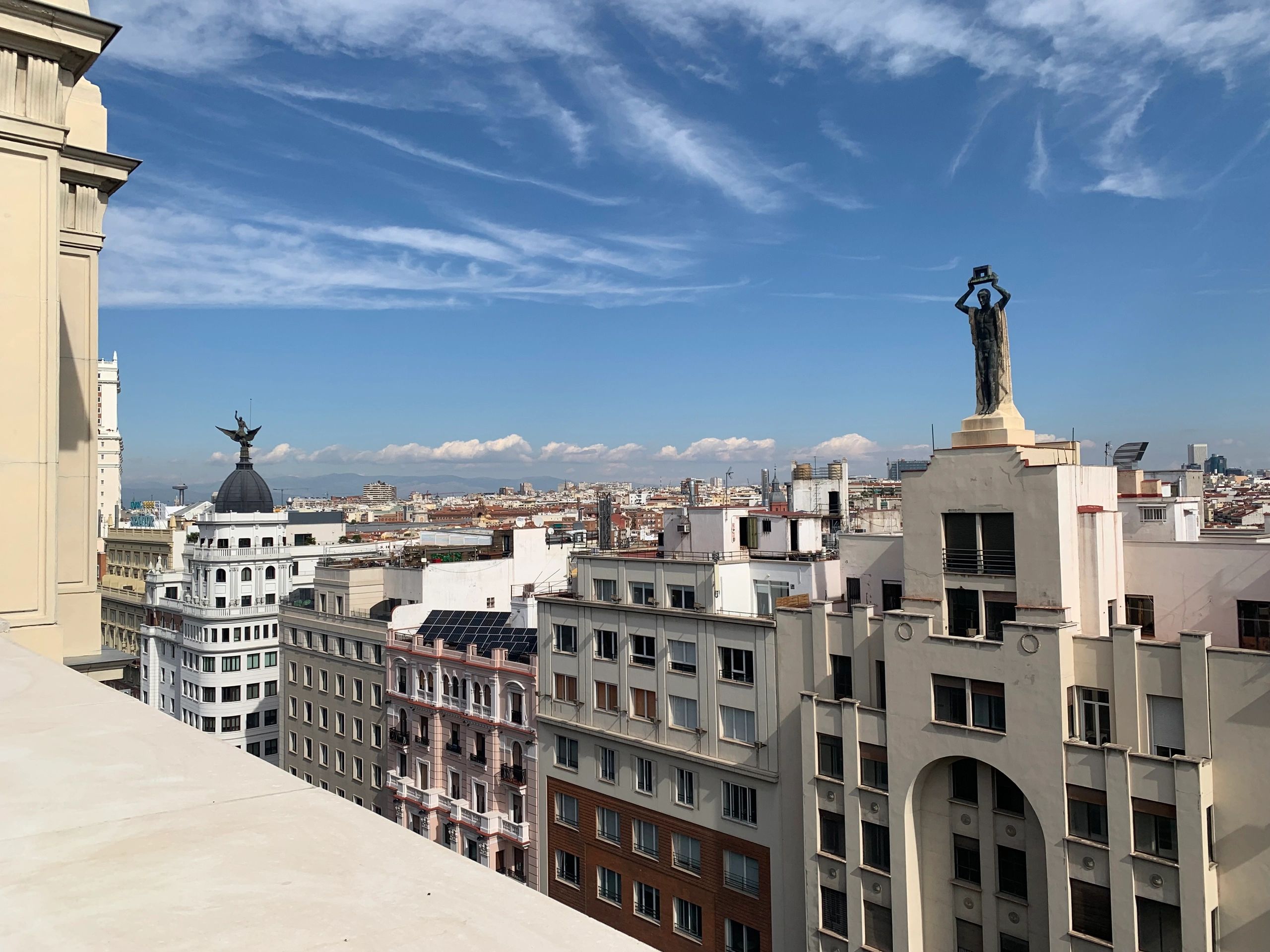 Rooftop view across a European city skyline for a city break guide