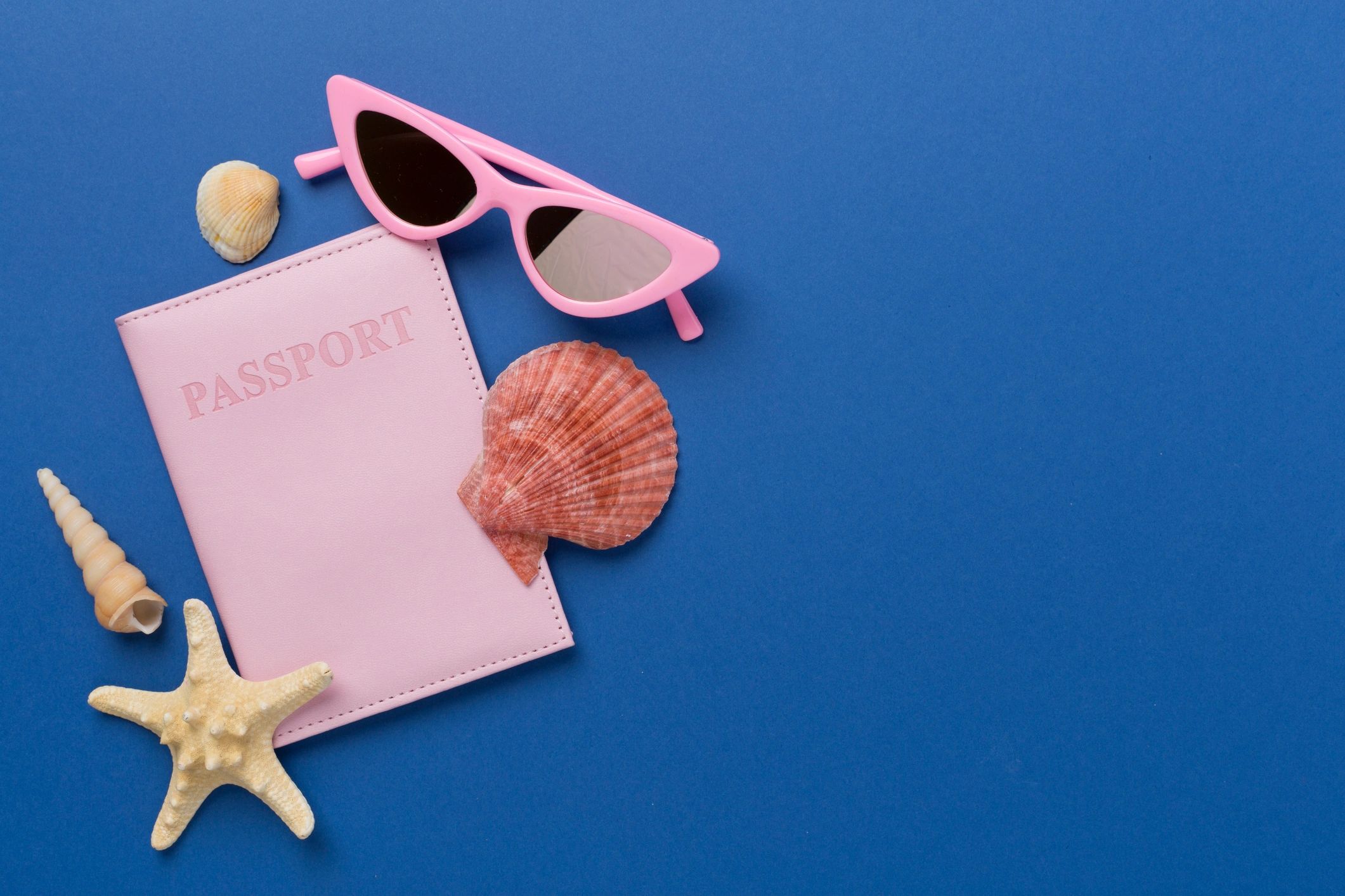 Travel packing accessories arranged neatly for a holiday planning guide