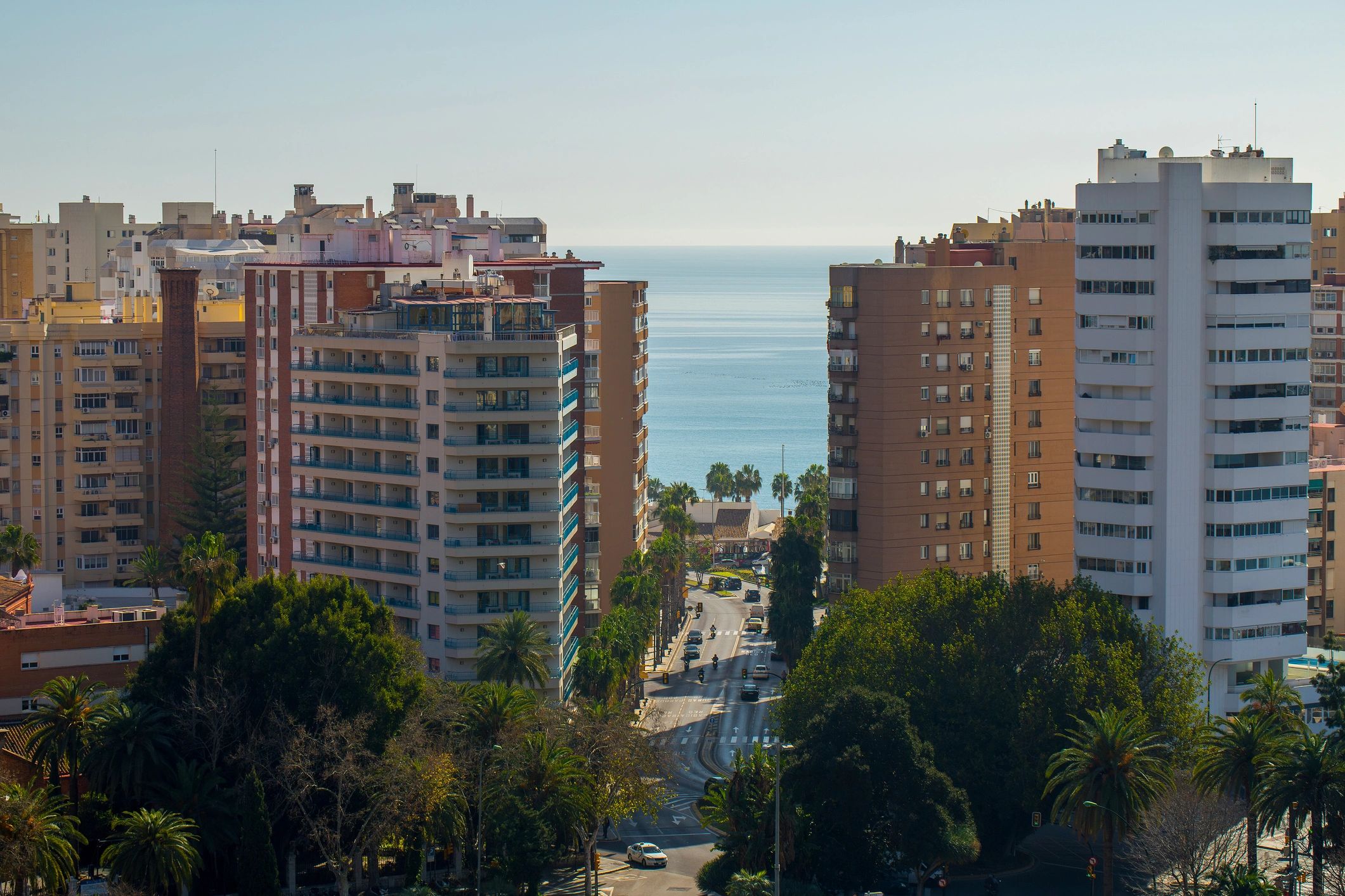 Malaga seafront hotels and apartments in La Malagueta under blue sky