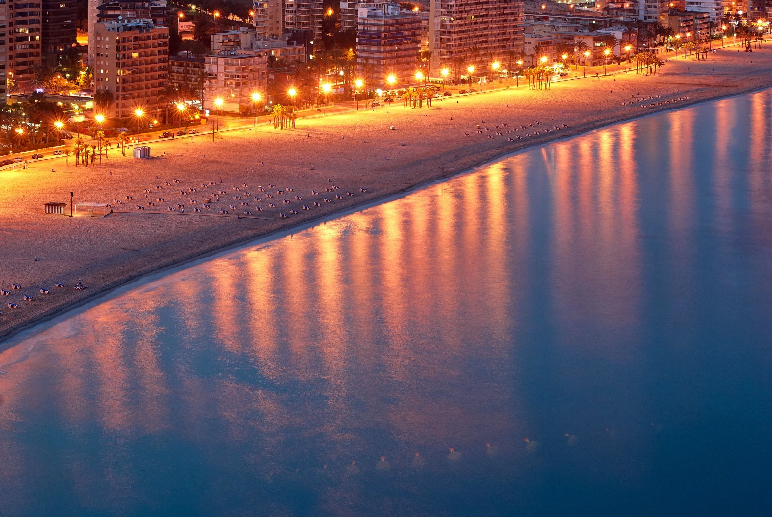 Benidorm hotels lit up along the seafront at night