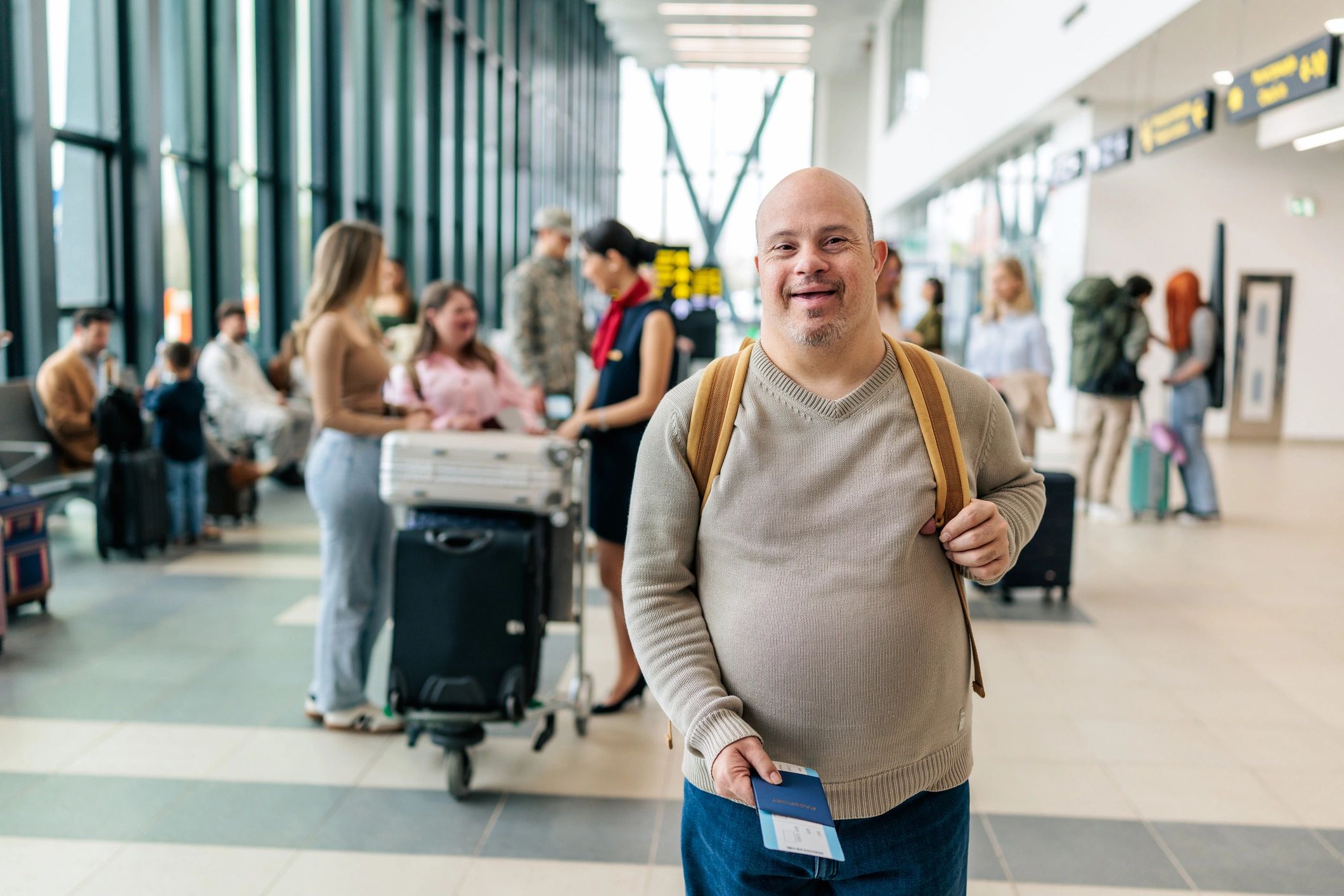 Traveller holding passport in an airport terminal