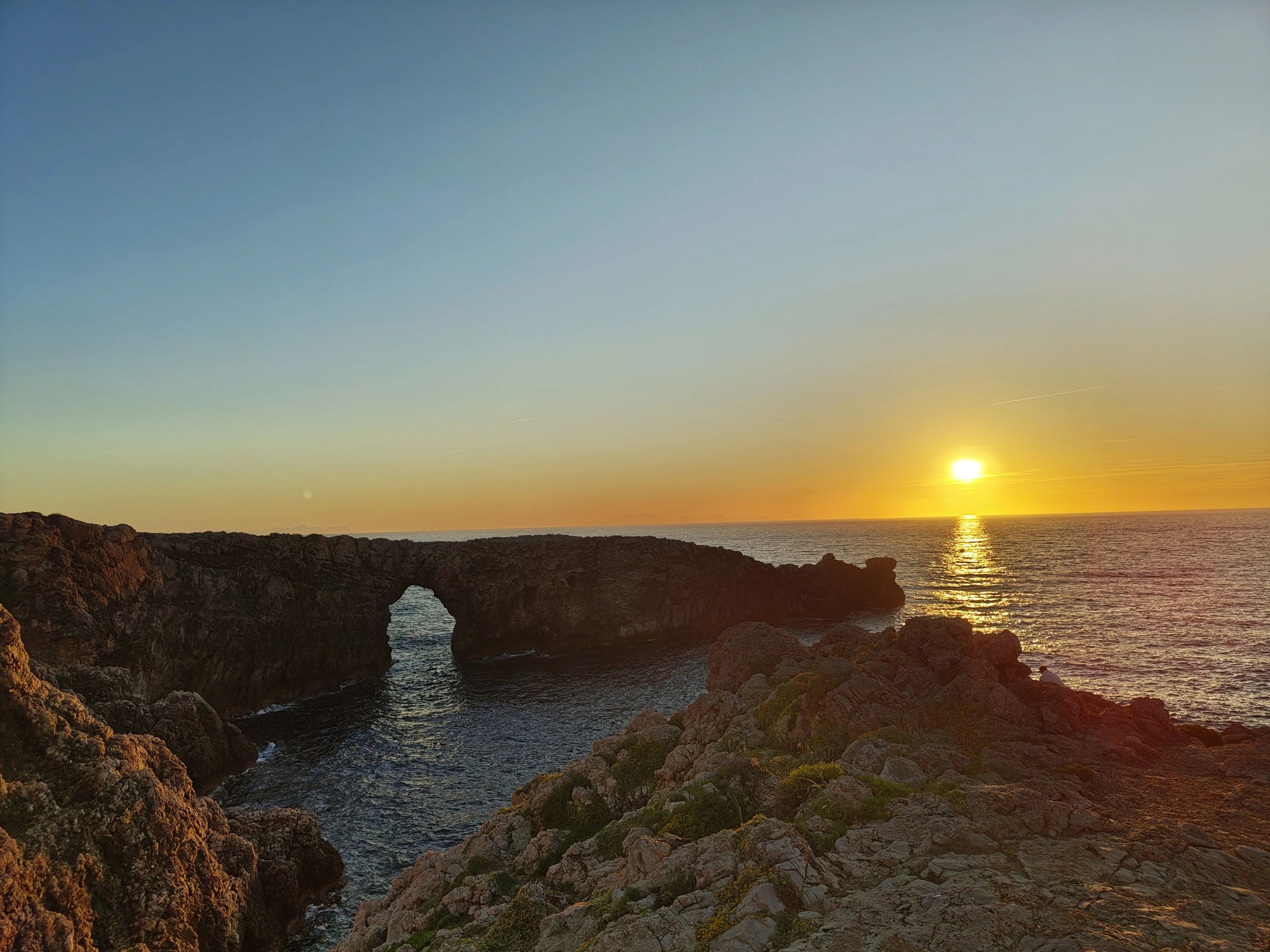 Sunset coastline in Menorca near romantic hotel areas