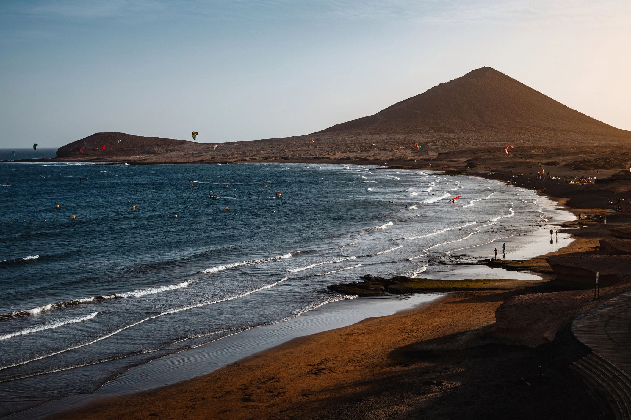 Sunset view across Tenerife coastline with volcanic landscape and Atlantic Ocean