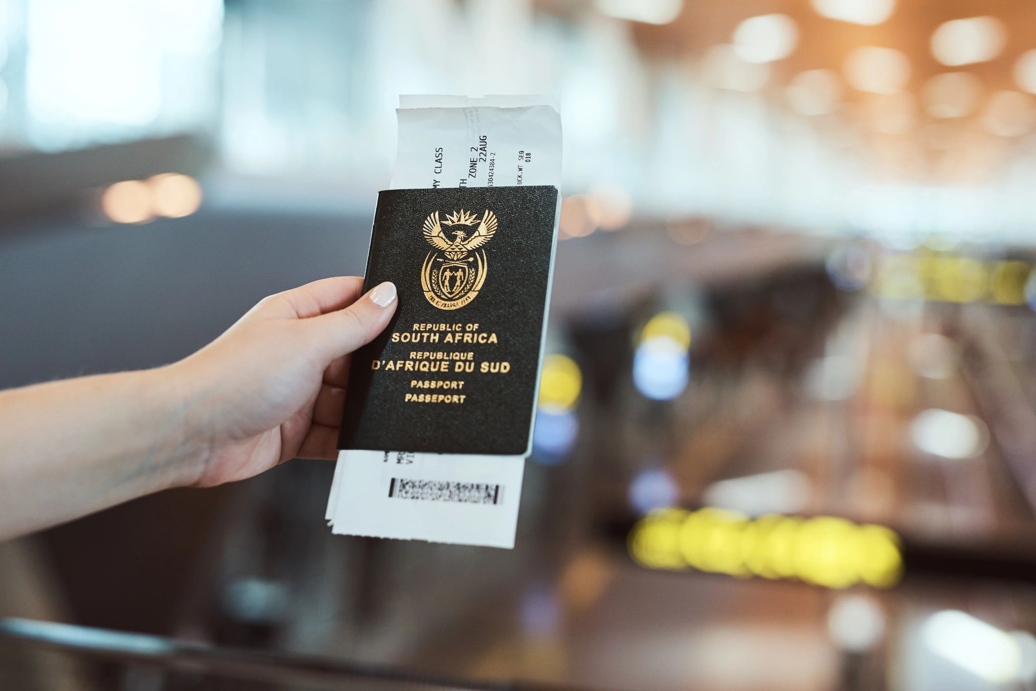 Traveller holding passport and travel document at the airport